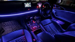 Car interior with blue ambient lighting upgrade.