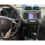Toyota Land Cruiser dashboard featuring Apple CarPlay/Android Auto integration for navigation and entertainment.